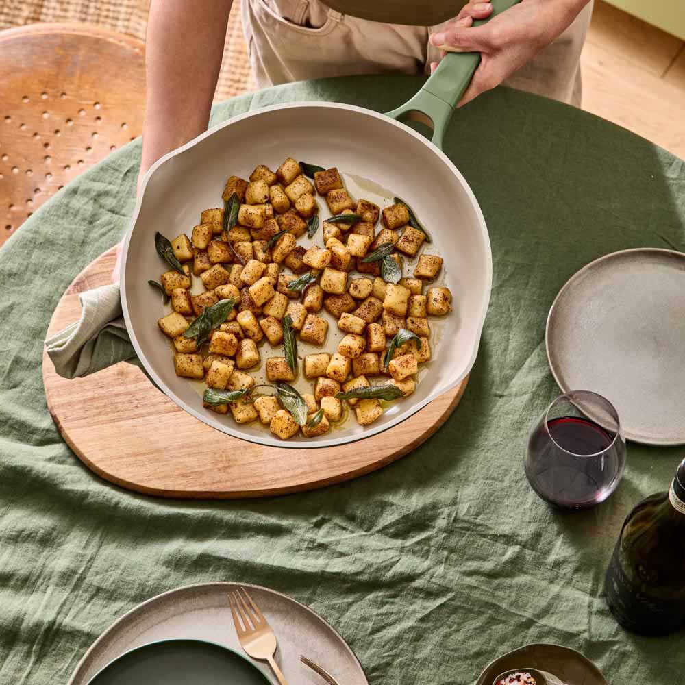 gnocchi with burnt butter sauce served from a green frypan