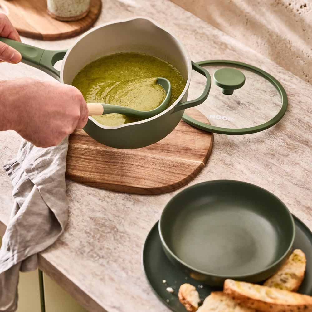 pea soup served from a green saucepan