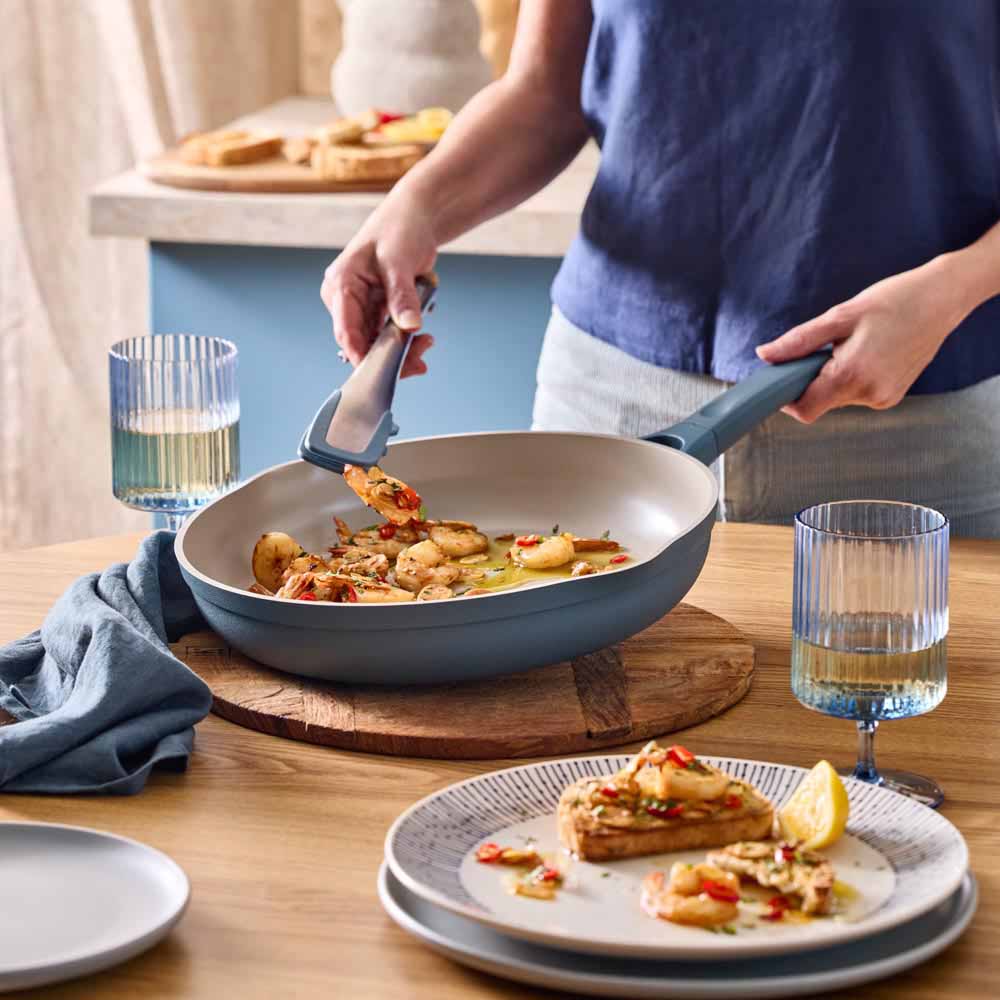 seafood marinara served from a blue frypan