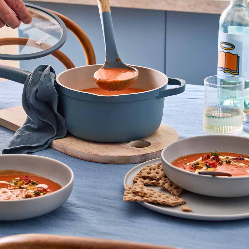 tomato soup served from a blue saucepan