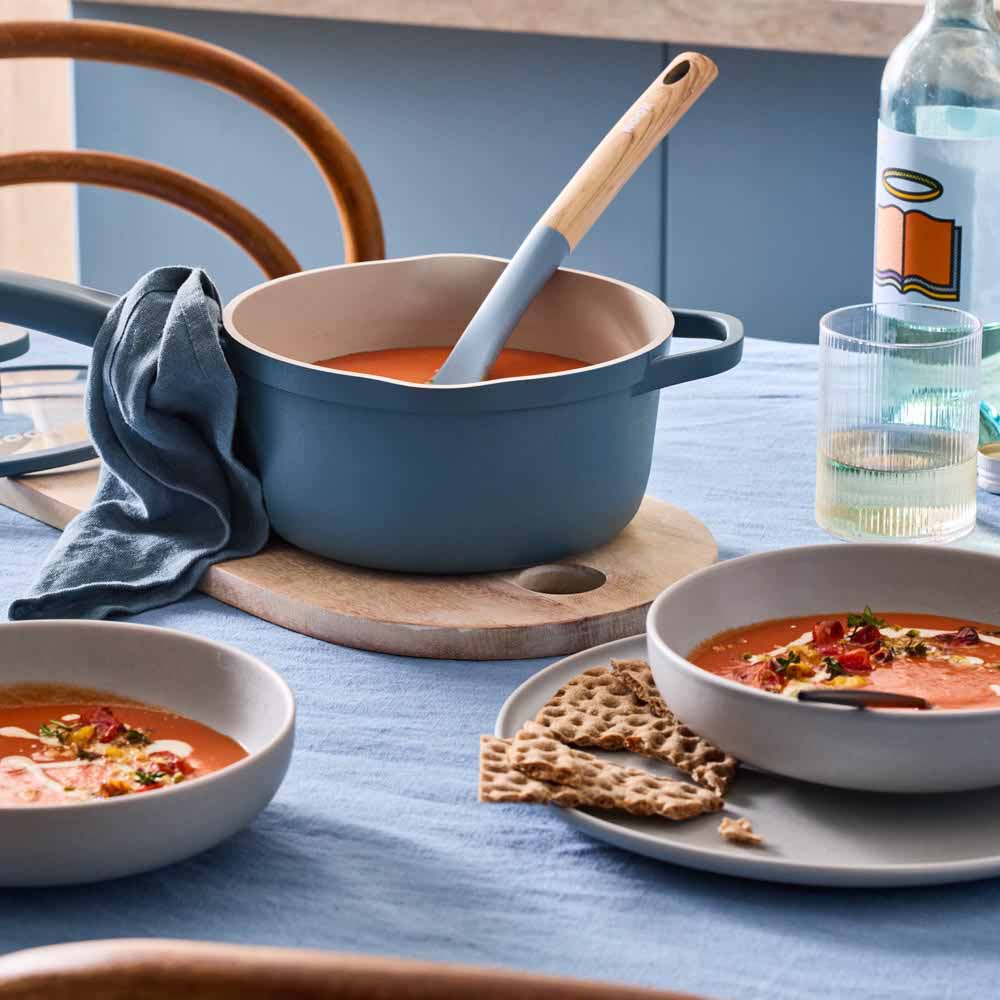 tomato soup served from a blue saucepan