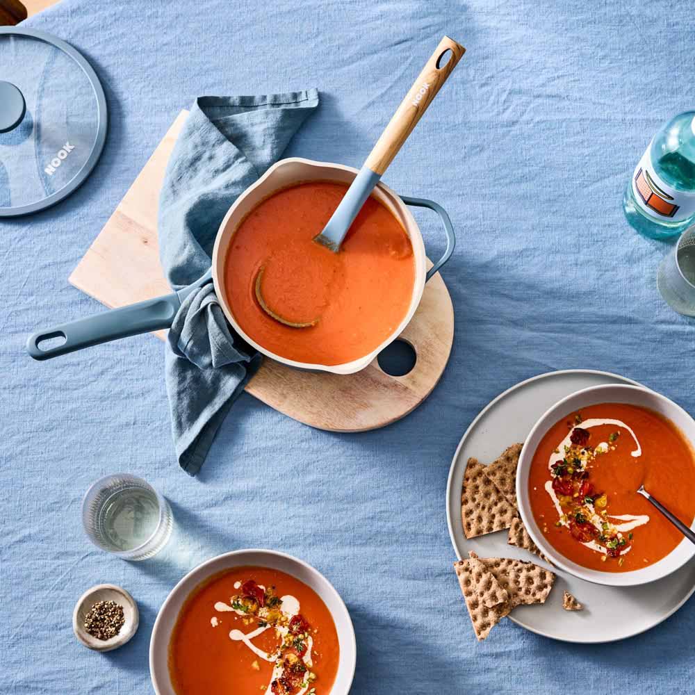 tomato soup served from a blue saucepan