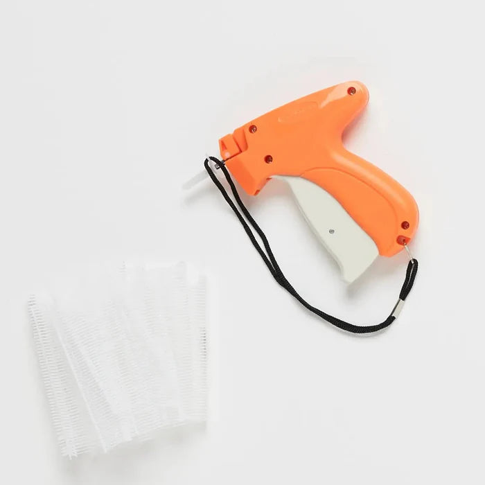 Orange and white tagging gun on a white background