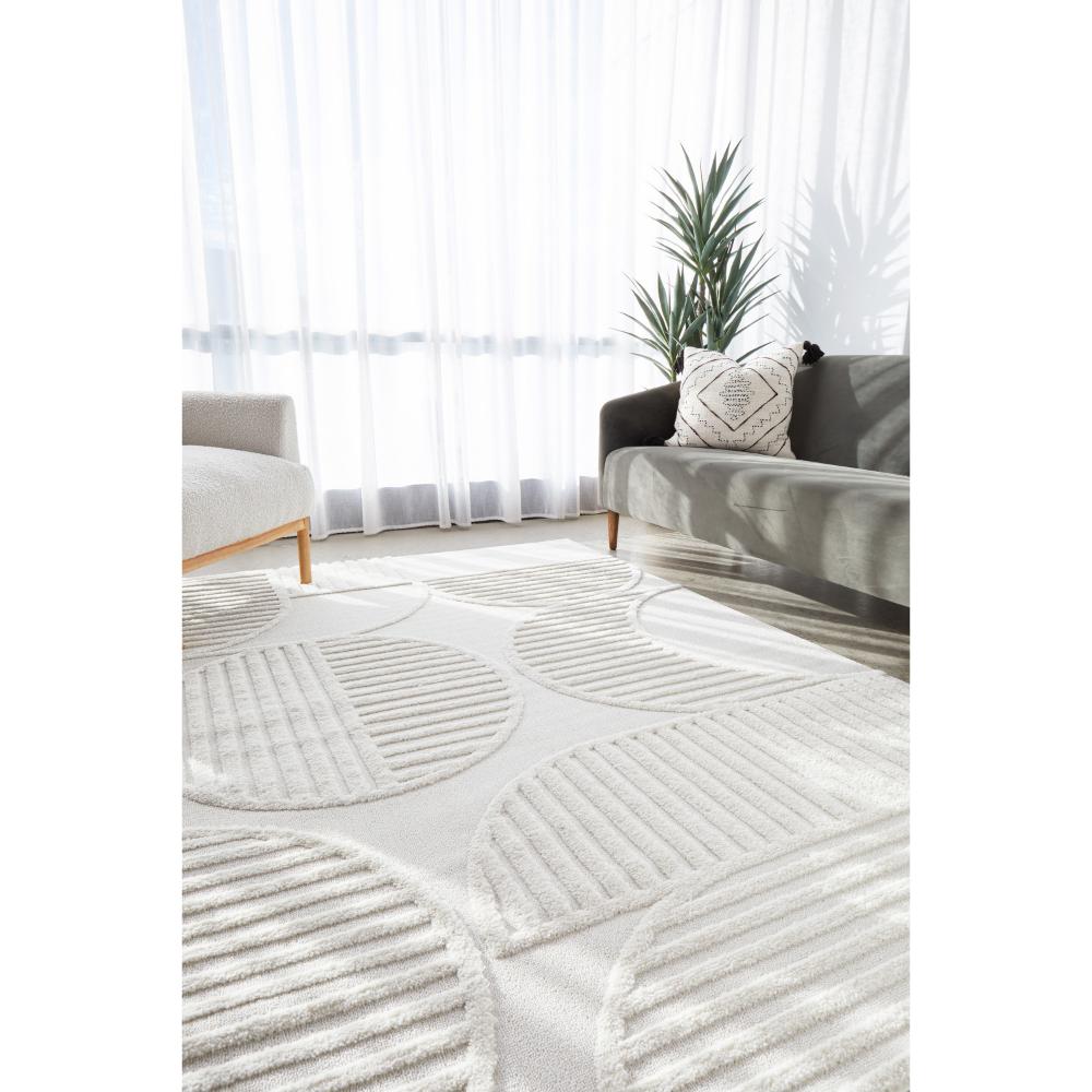 Rug Culture Lotus Leo Rug in White in lounge room at House