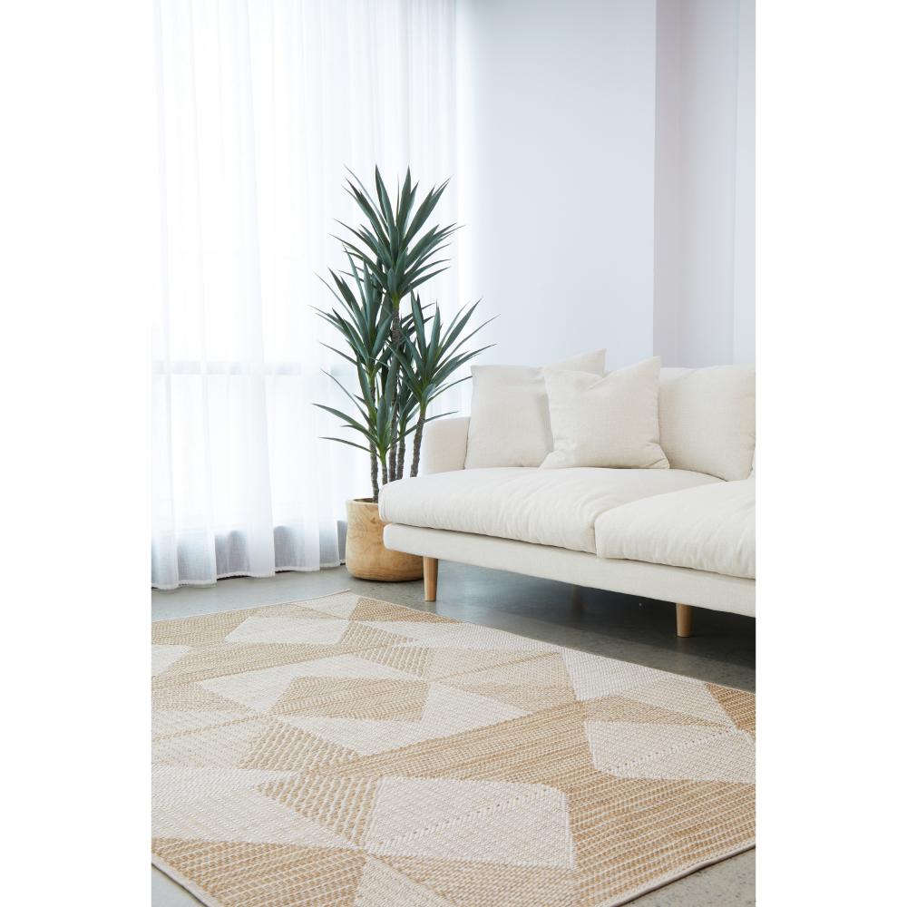 Indoor/outdoor natural brown beige geometric rug in a loungeroom - House
