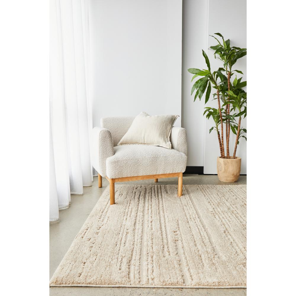 Rug Culture Serenade Ezra Rug Natural with cream boucle chair at House