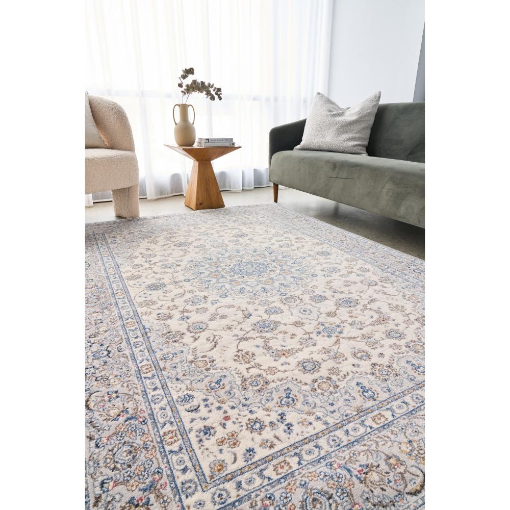 Vintage look blue and cream wool rug in a loungeroom - House