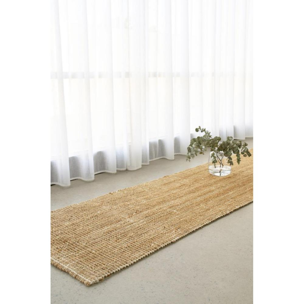 Natural brown jute hampton floor runner by the window - House