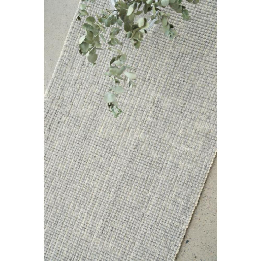 grey Hamptons style jute wool rug with native foliage in a vase - House