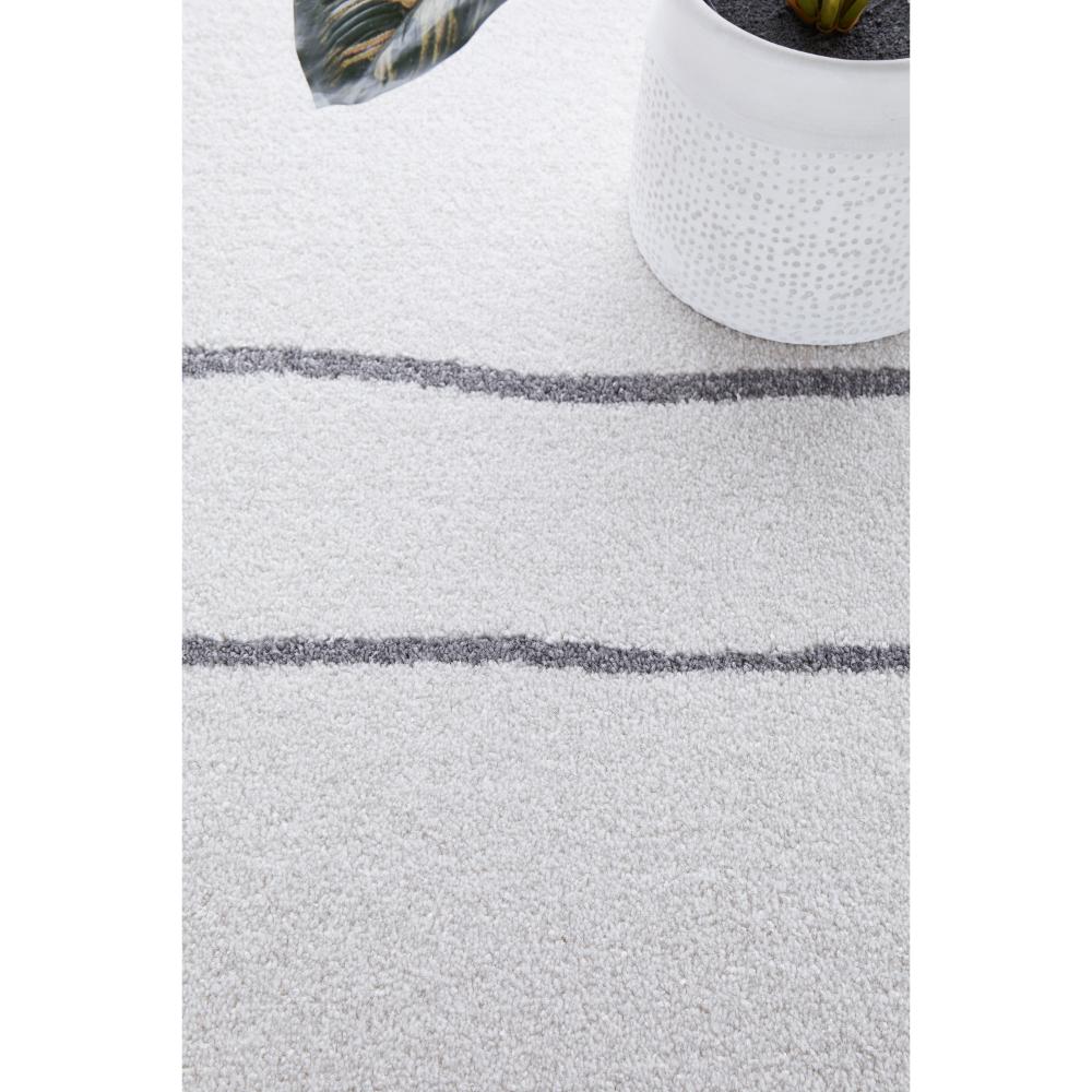 grey modern abstract rug with white pot plant - House