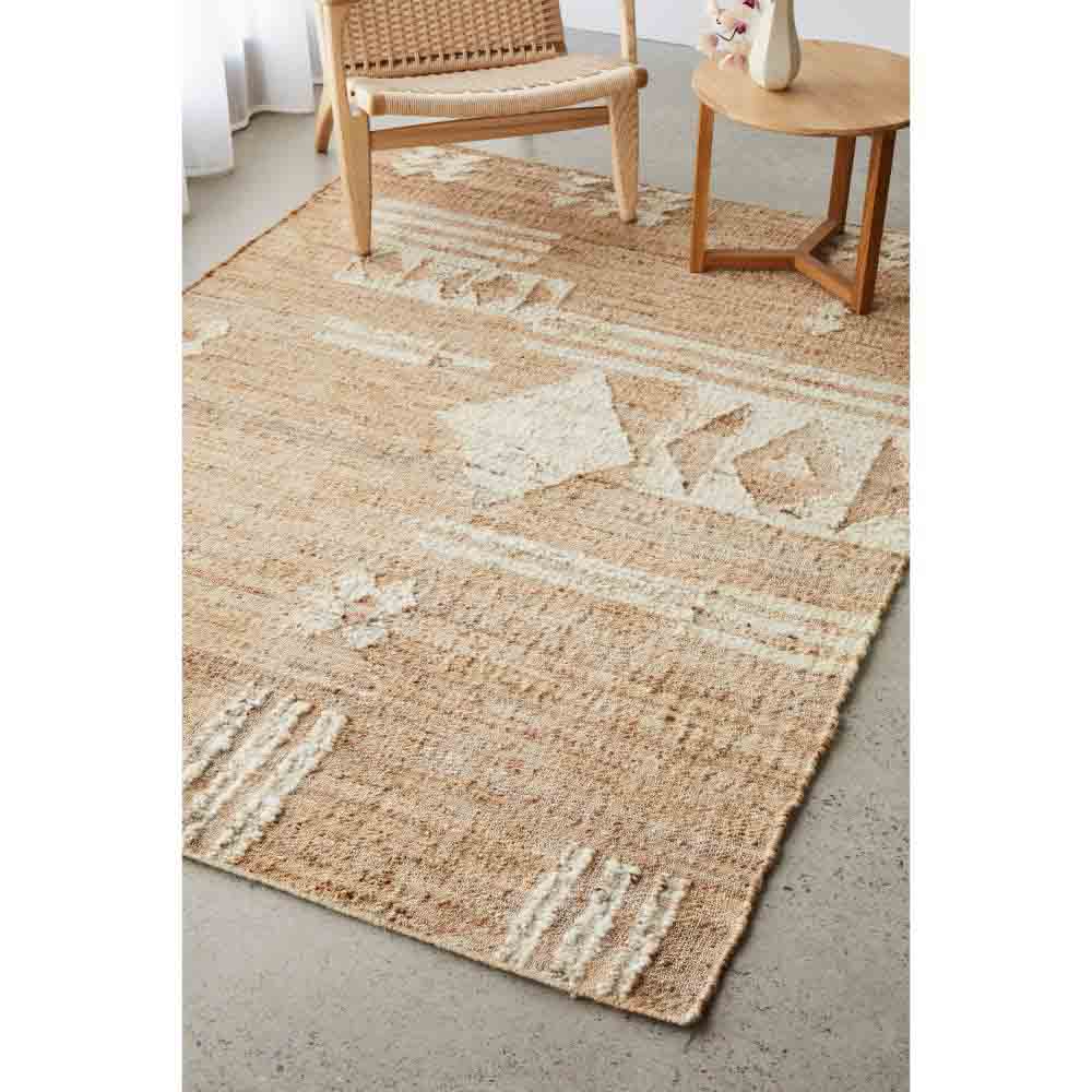 warm beige patterned jute boho rug with armchair and table - House