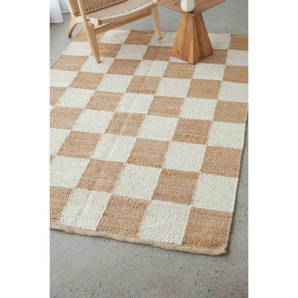 warm beige checkboard jute rug with armchair - House