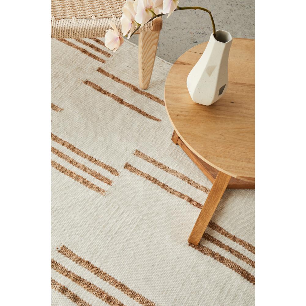 beige wool jute modern rug with armchair and table - House