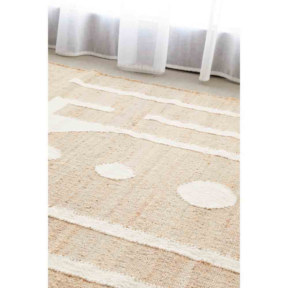 Natural beige wool jute bohemian rug by the window - House