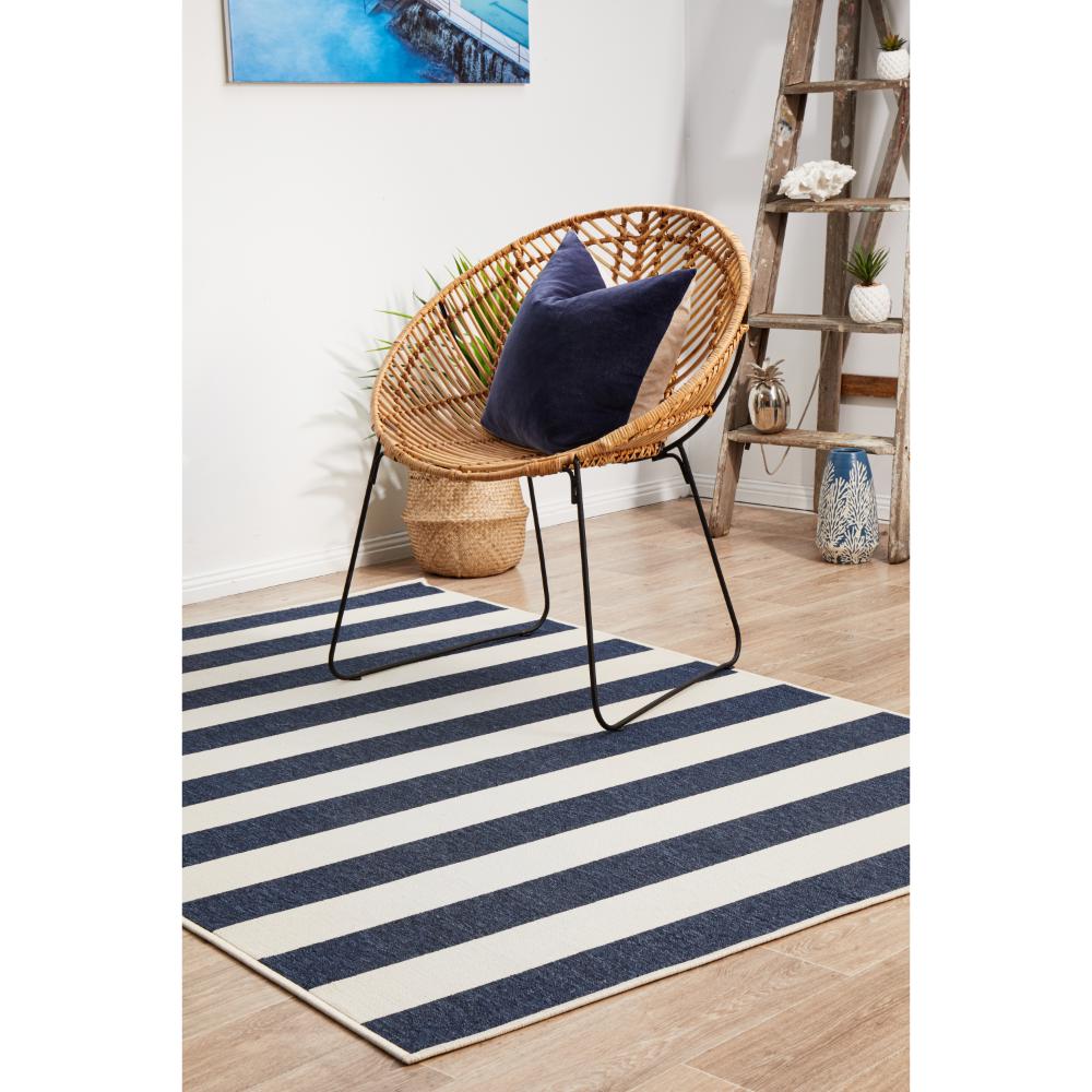 Blue and white stripe indoor/outdoor rug with armchair - House