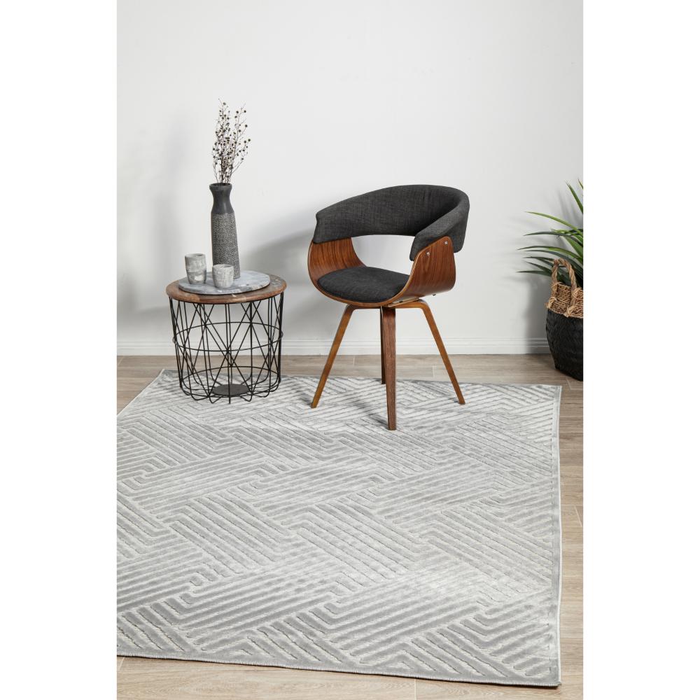 silver grey chevron rug with armchair and side table - House