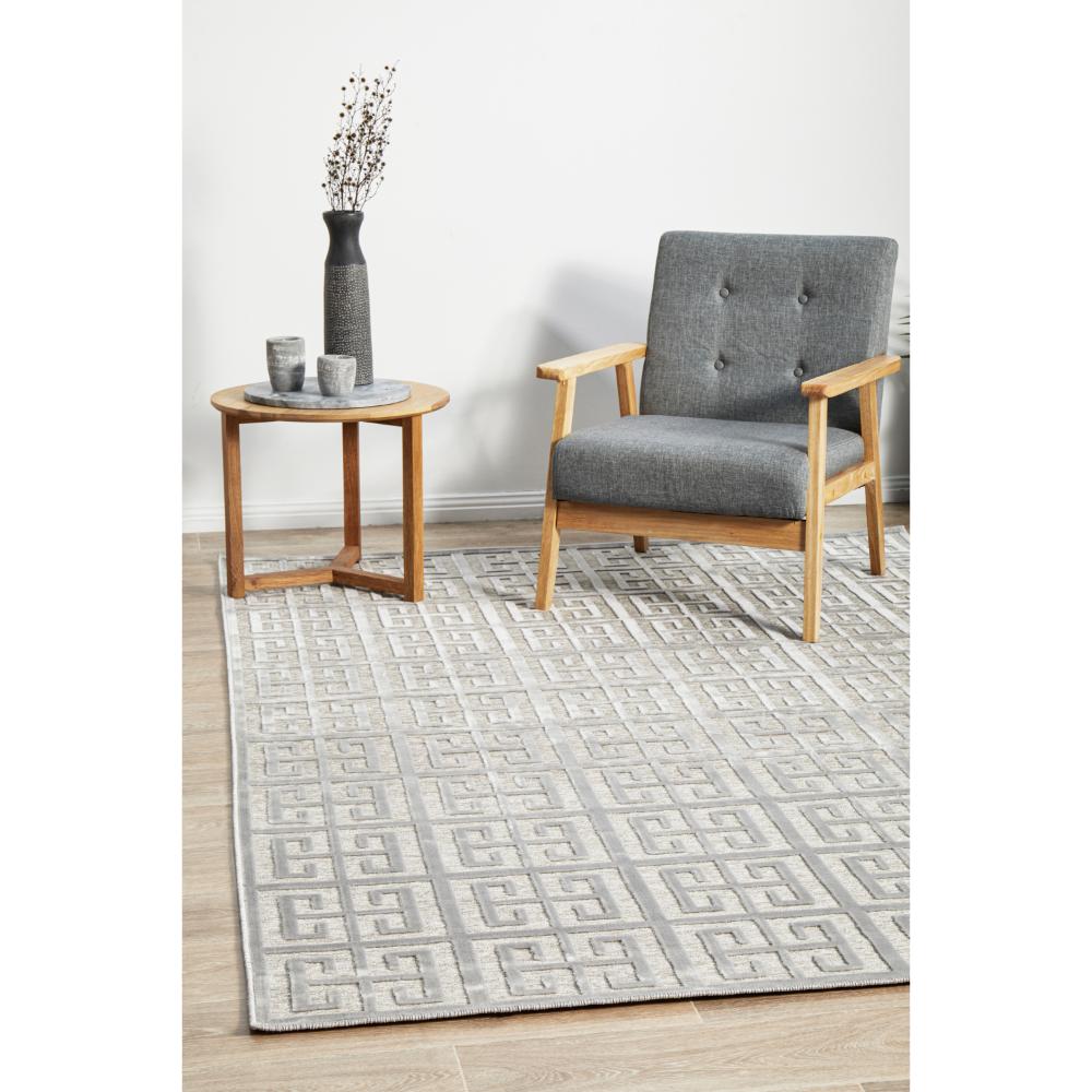 silver grey art deco tile rug with armchair and table - House