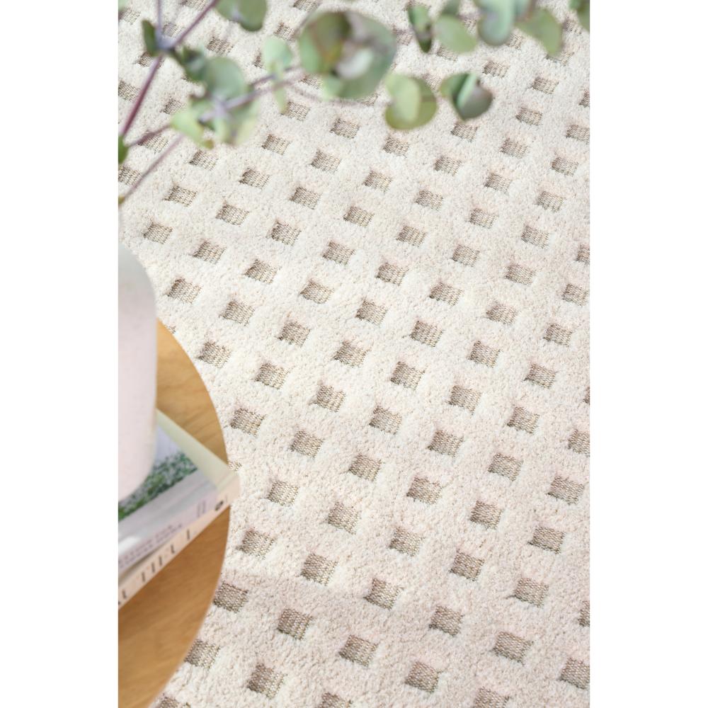 Natural beige small grid rug with table, books and vase - House