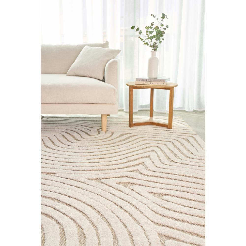 Natural beige swirl rug with lounge and side table - House