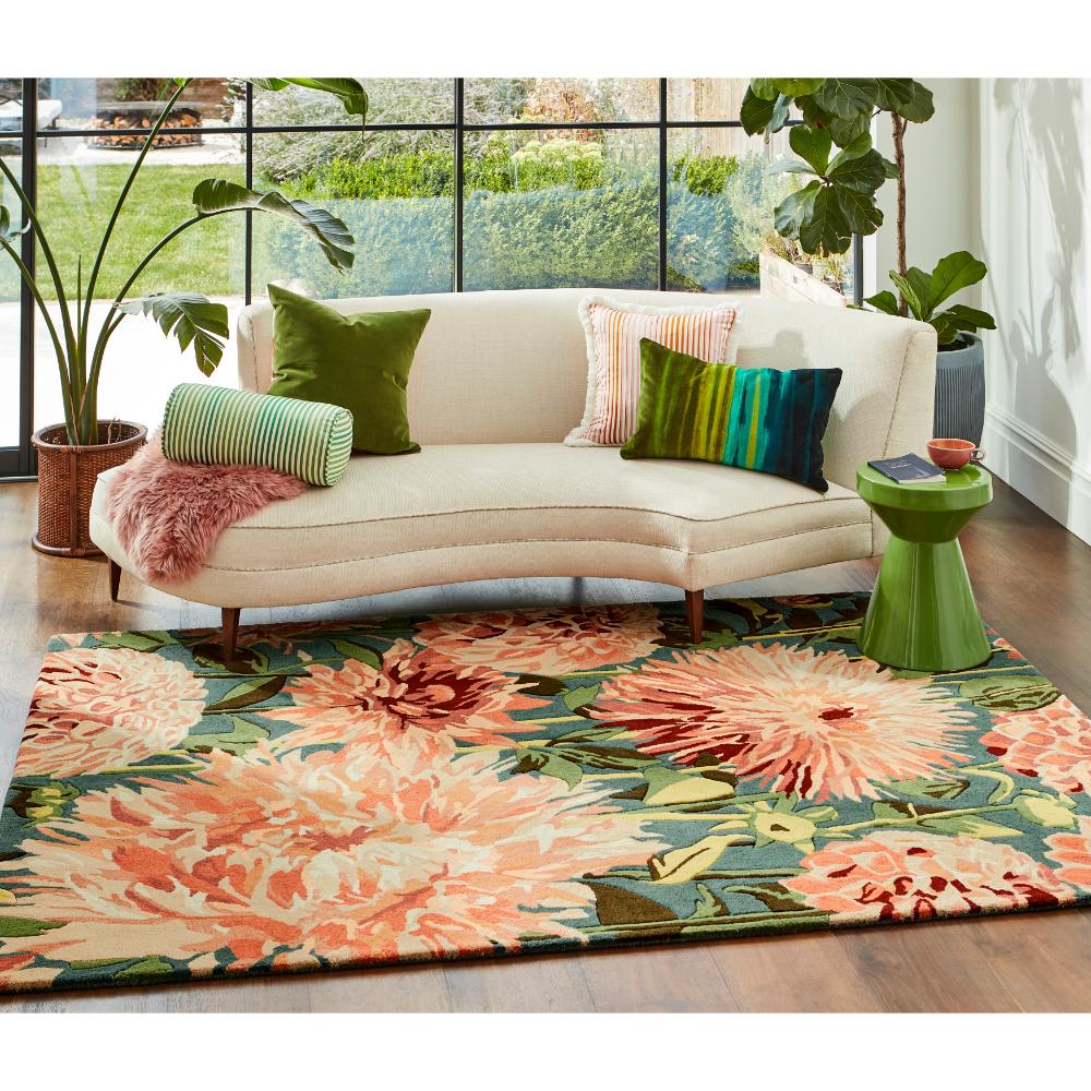 large orange dahlia flower wool rug in styled loungeroom - House