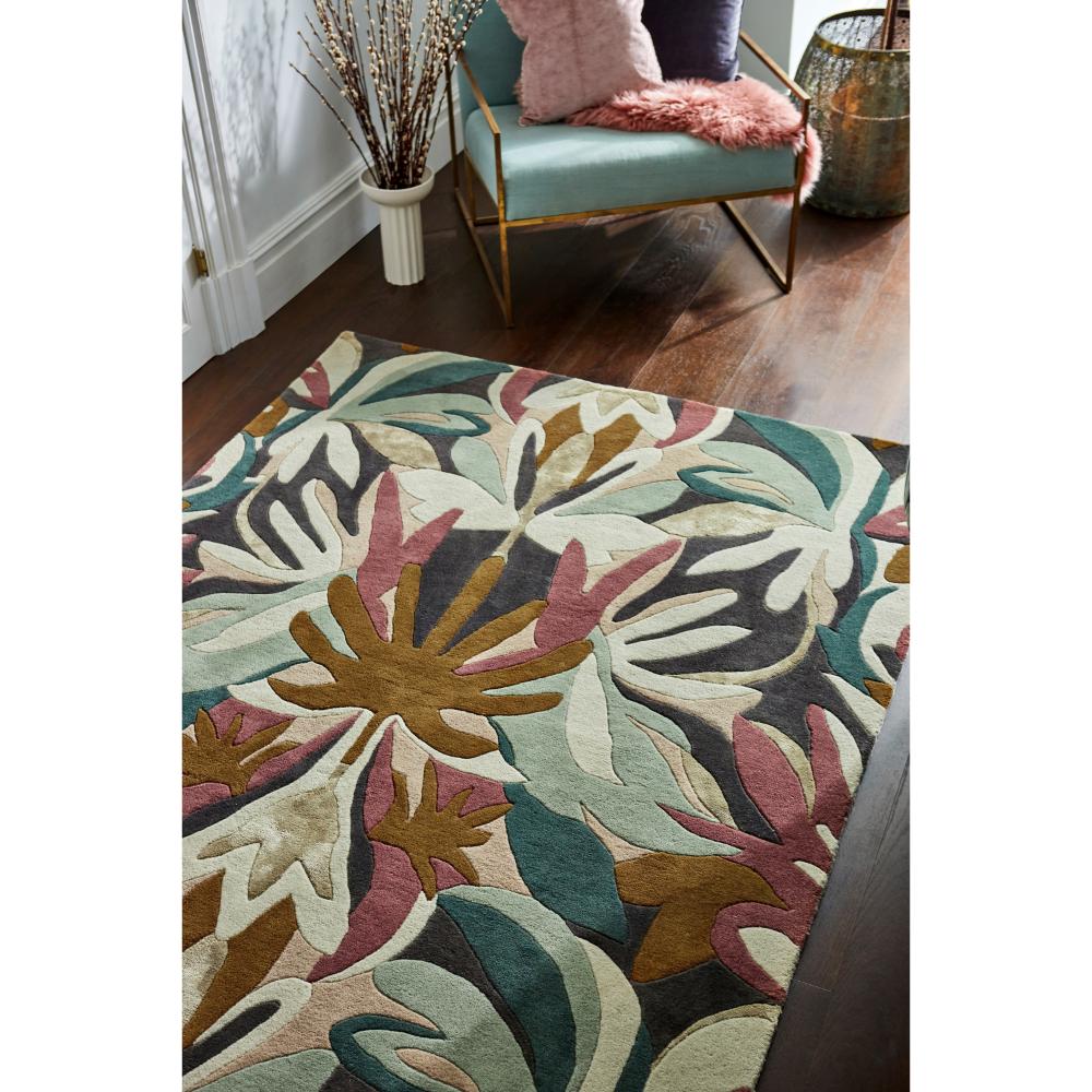 Green and burgundy Floral Wool Rug with green armchair - House