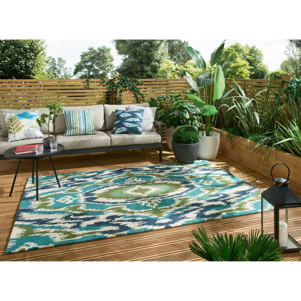 Blue, green Indoor/Outdoor Rug in outdoor sitting area - House