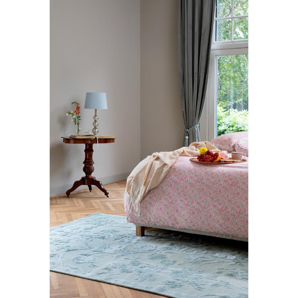 sage green flower embossed rug under pink floral bed - House
