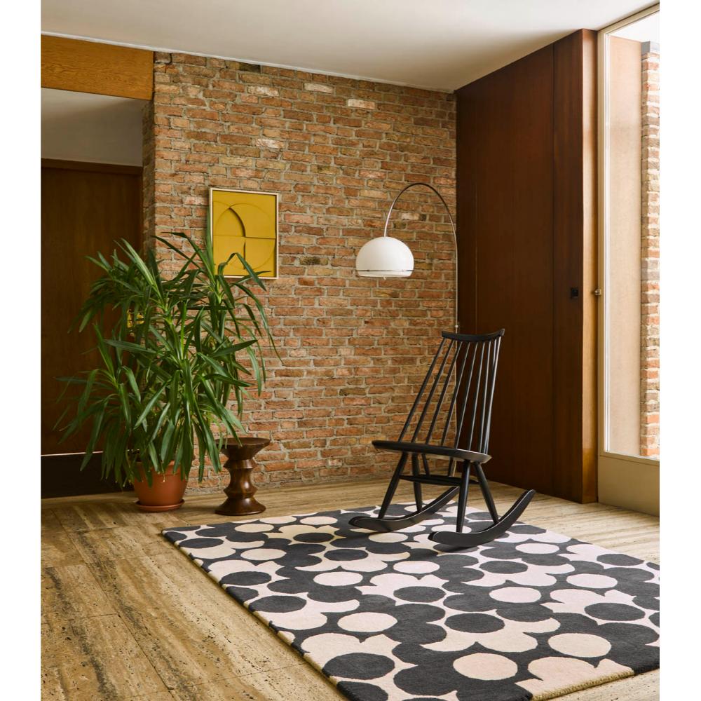 Grey and white flower rug with wooden rocking chair - House