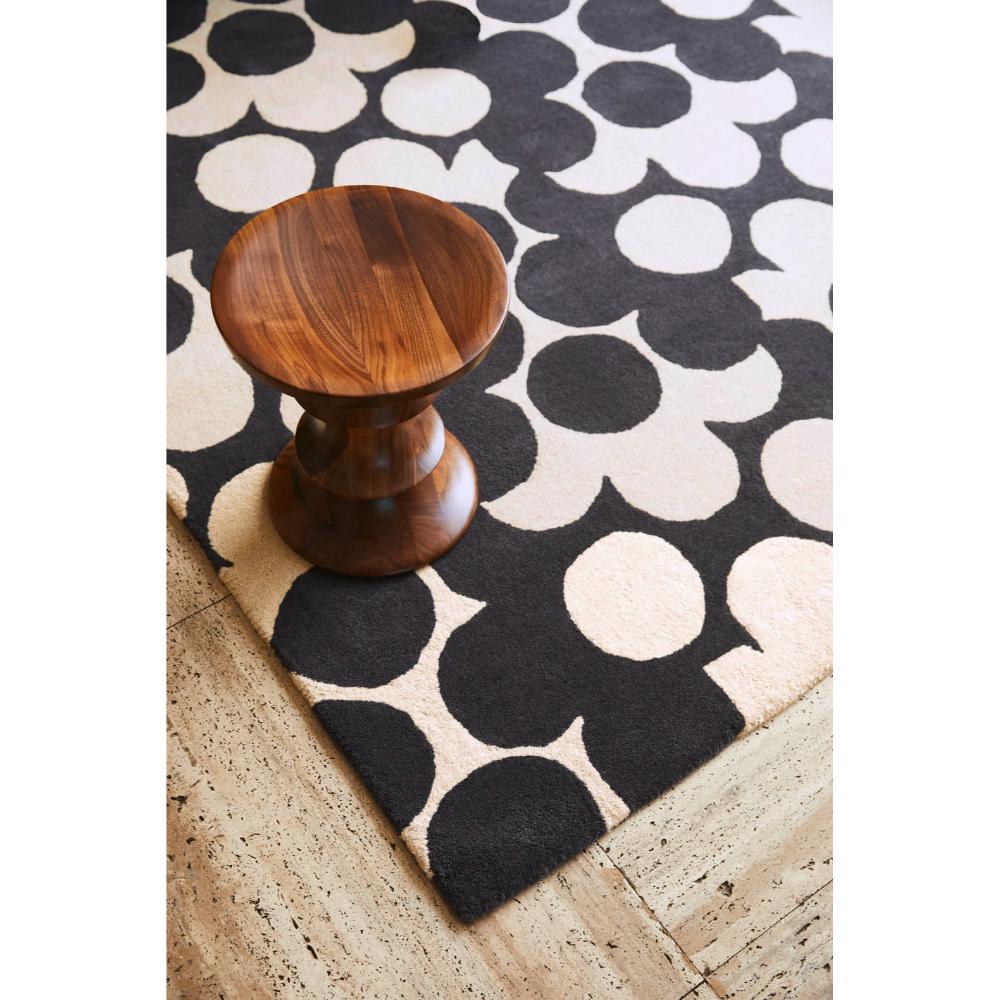 Grey and white flower rug with wooden stool - House
