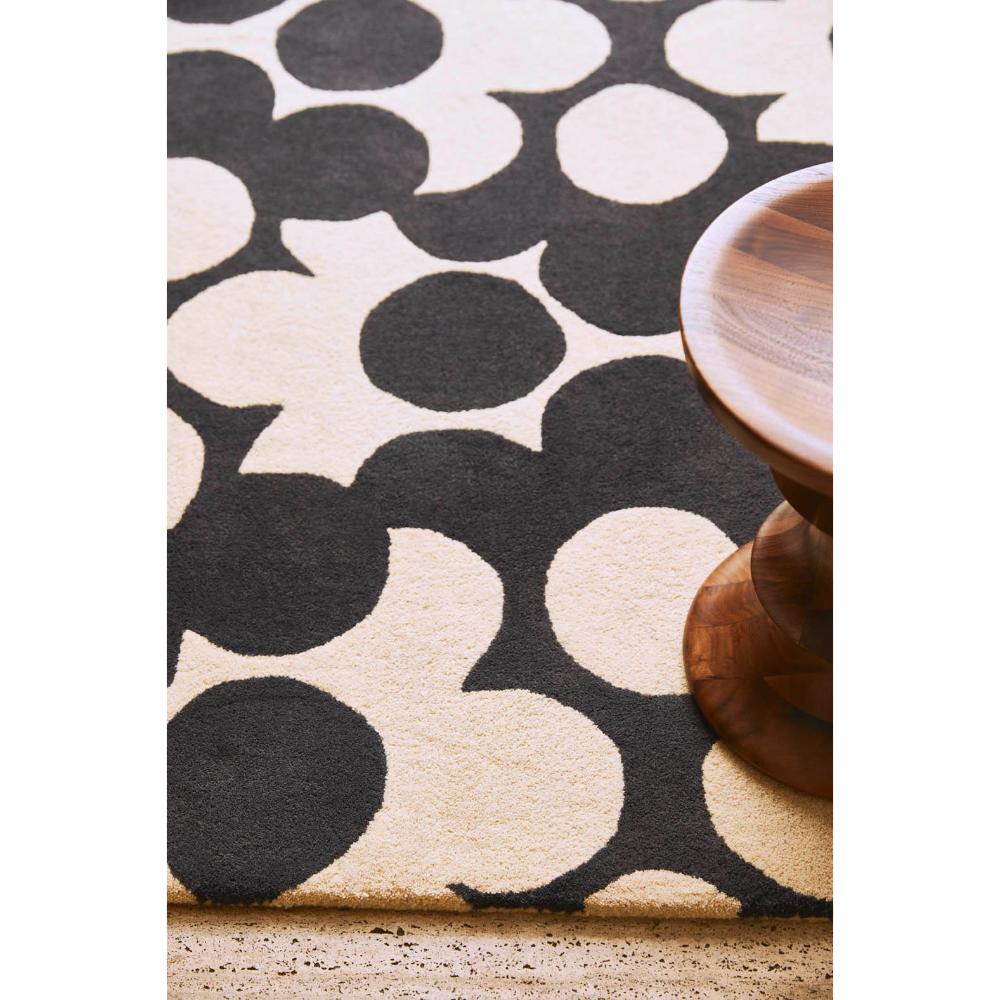 Grey and white flower rug with wooden stool - House