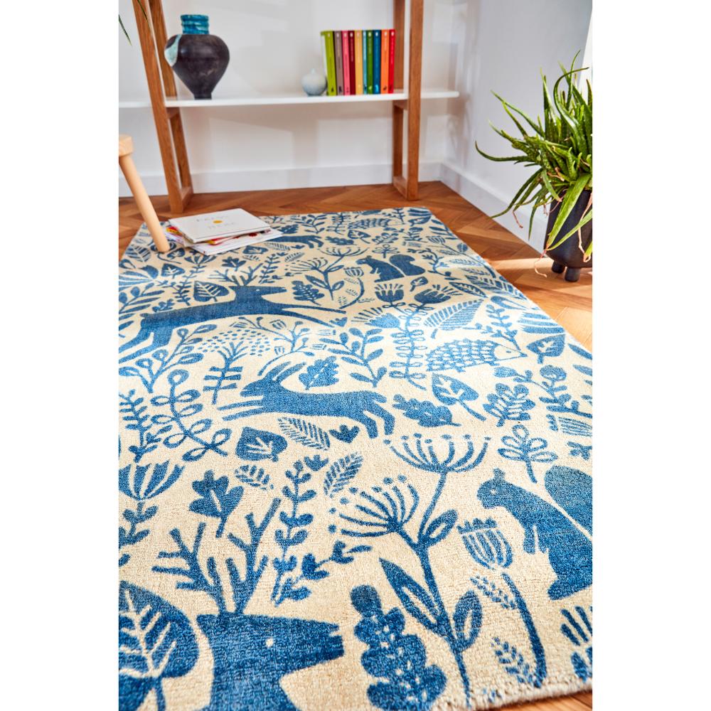 blue printed woodland creatures wool rug in sitting room - House