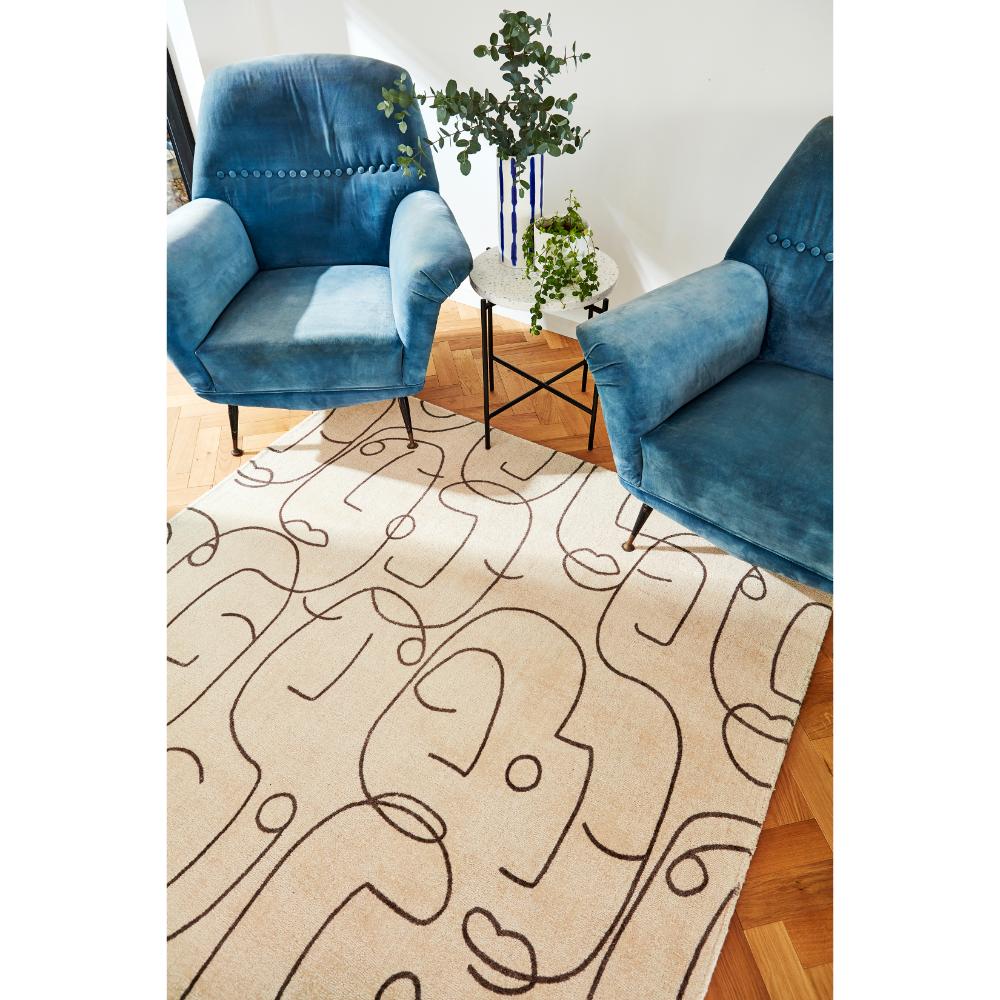 abstract face design Wool Rug with blue armchairs - House