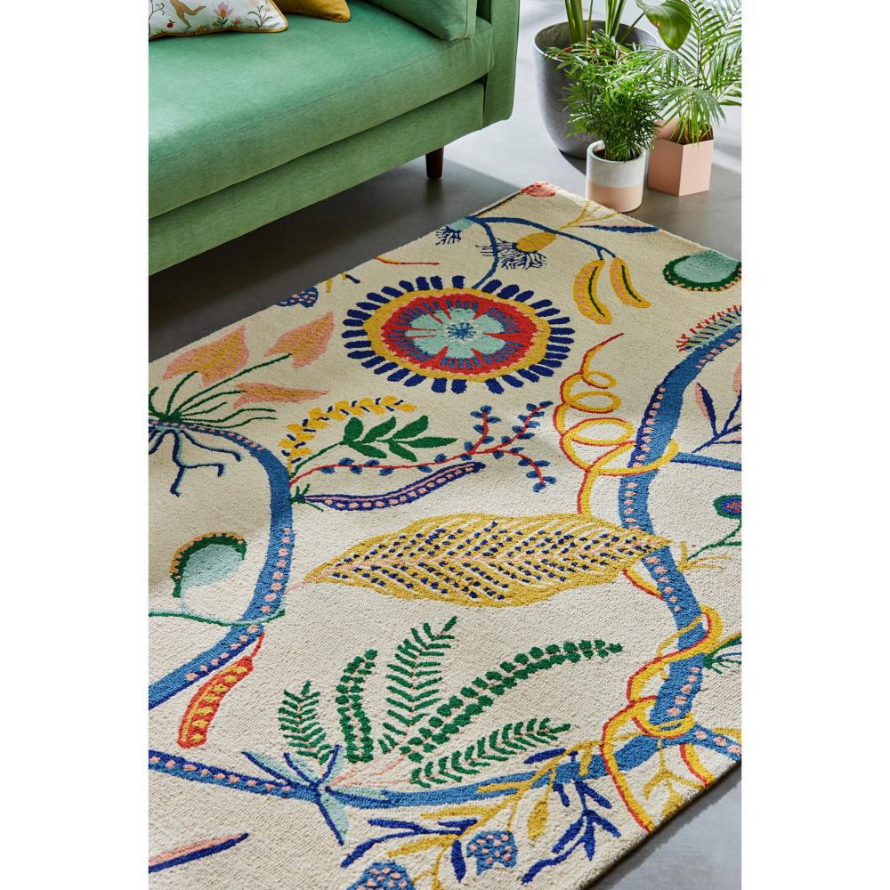 multicolour floral rug with green lounge - House