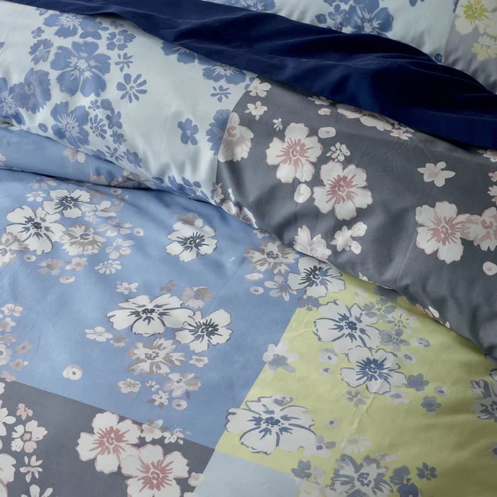 Floral patterned fabric with blue, gray, and green colors.