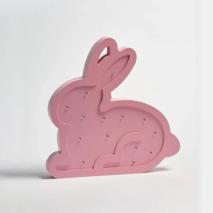 Pink bunny-shaped decorative item with rhinestones on a white background