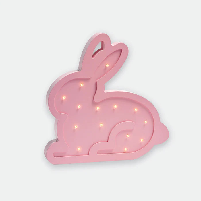 Pink bunny-shaped LED night light on a white background