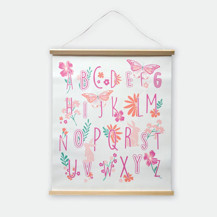 Framed alphabet poster with decorative letters and illustrations on a white background