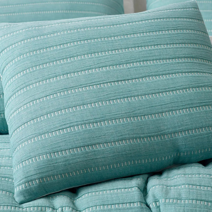 Close-up of teal textured fabric with horizontal stripes