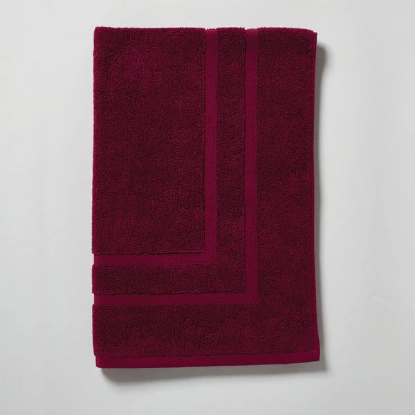 Burgundy bath mat folded