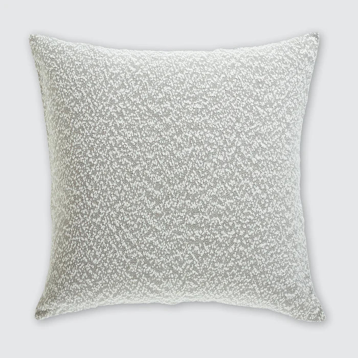 Silver sequin pillow on a light gray background