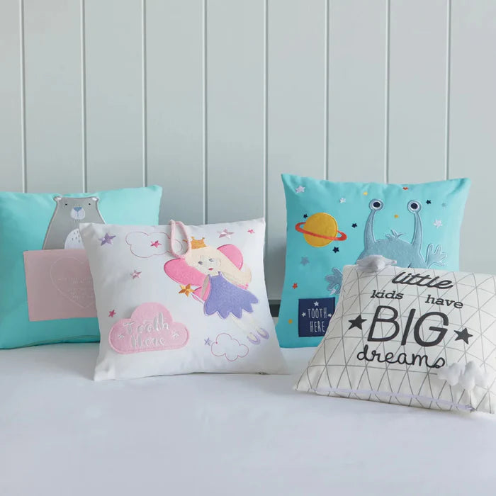 Four decorative pillows with cartoon designs on a light blue background