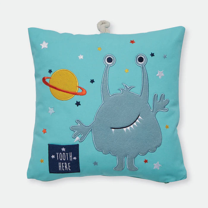 Children's pillow with alien design and 'Tooth Here' text on a blue background