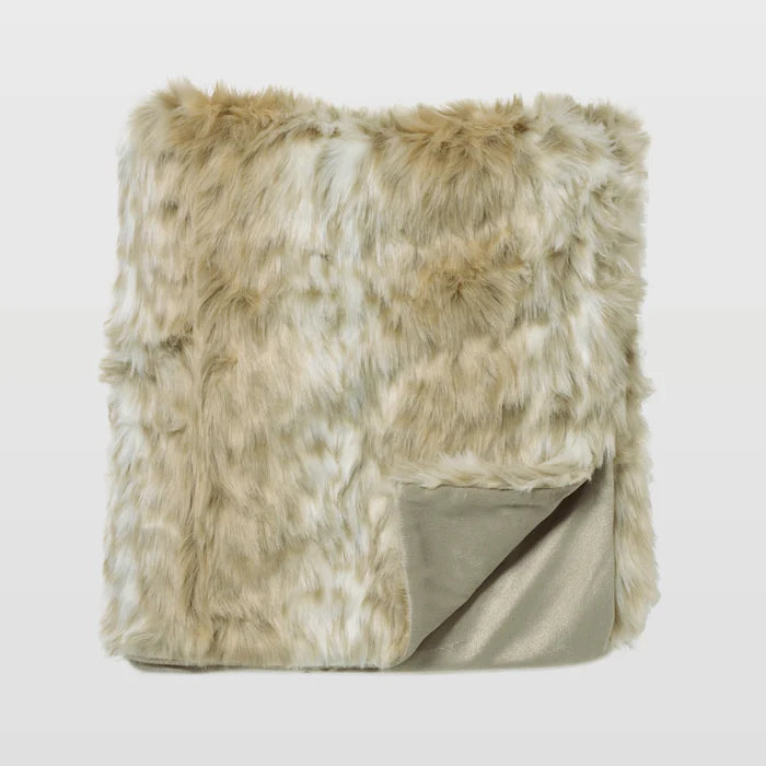 Beige and brown faux fur blanket on a light gray background