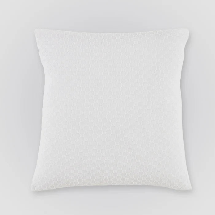 White textured pillow on a light gray background
