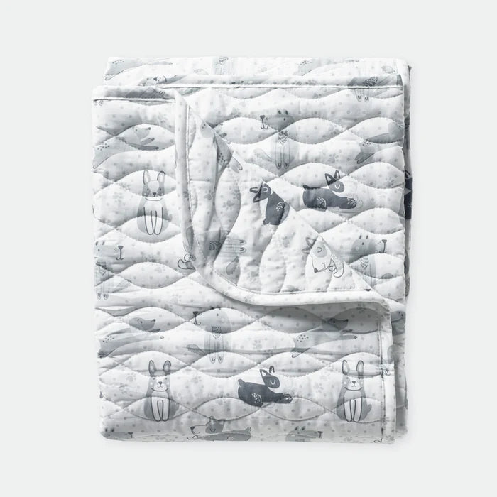 Quilt with animal pattern on a white background