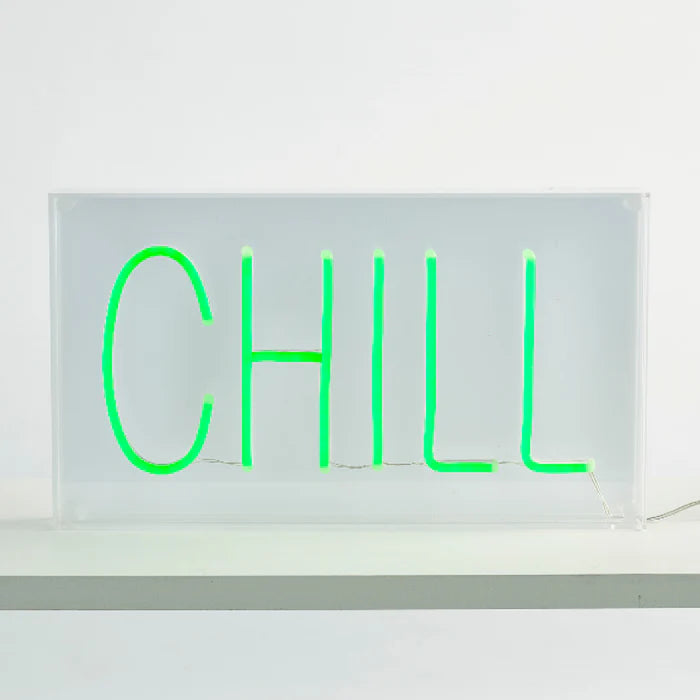 Neon sign with the word 'CHILL' on a white background