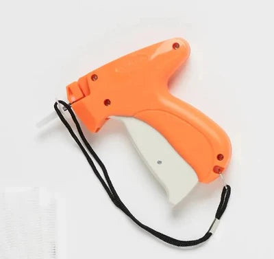 Orange and white gun-shaped tool on a white background